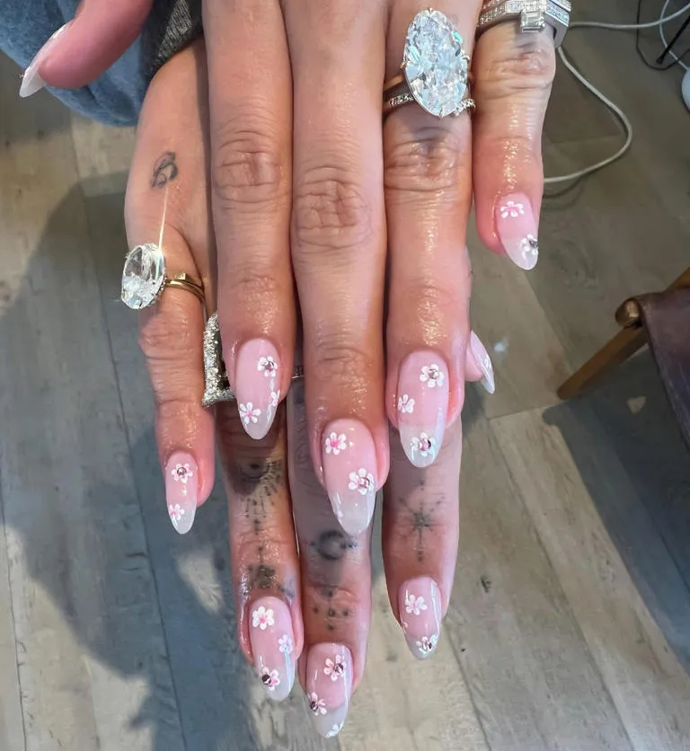 She flaunted the large oval diamond set on a gold band in new Instagram photos last week. nailsbyzola/Instagram