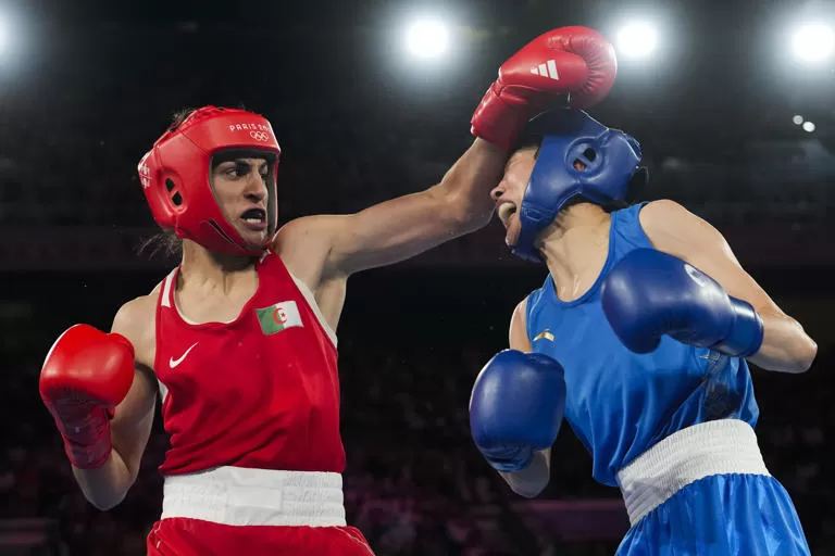 Algeria's Imane Khelif, left, fights China's Yang Liu in their women's 66 kg final boxing match at the 2024 Summer Olympics, Friday, Aug. 9, 2024, in Paris, France. (AP Photo/Ariana Cubillos)